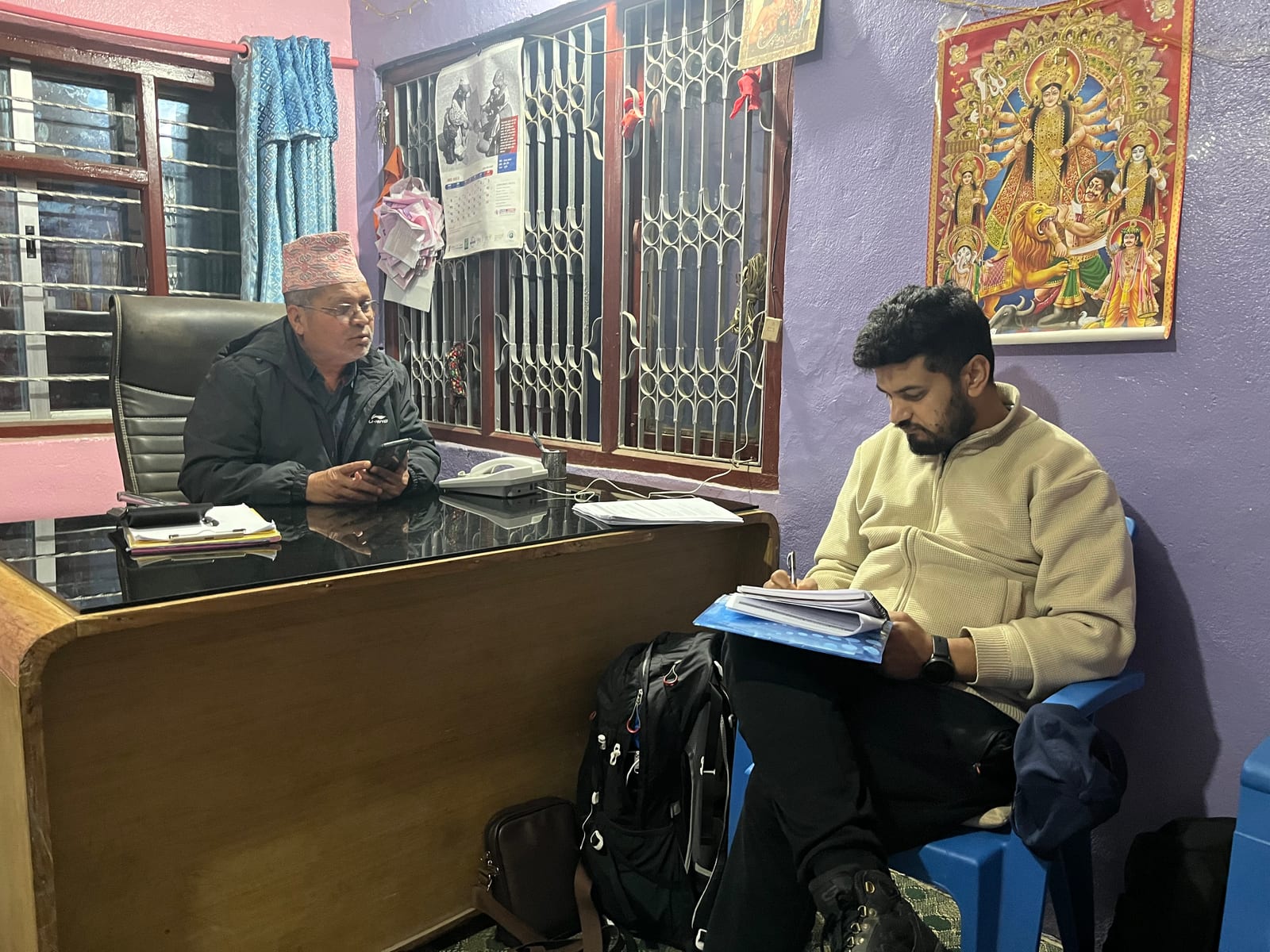 Talking with a large cardamom collector