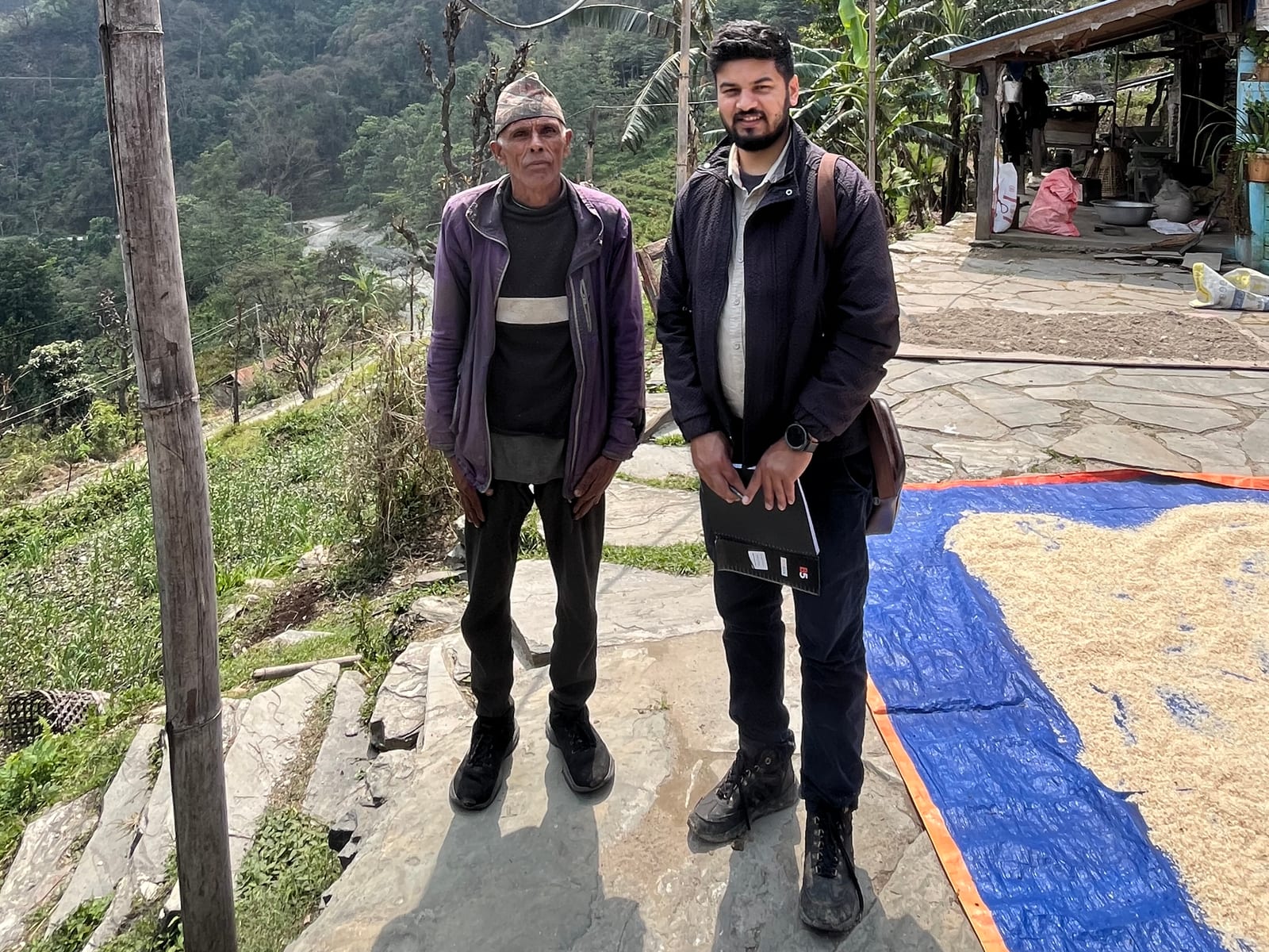 With a large cardamom farmer