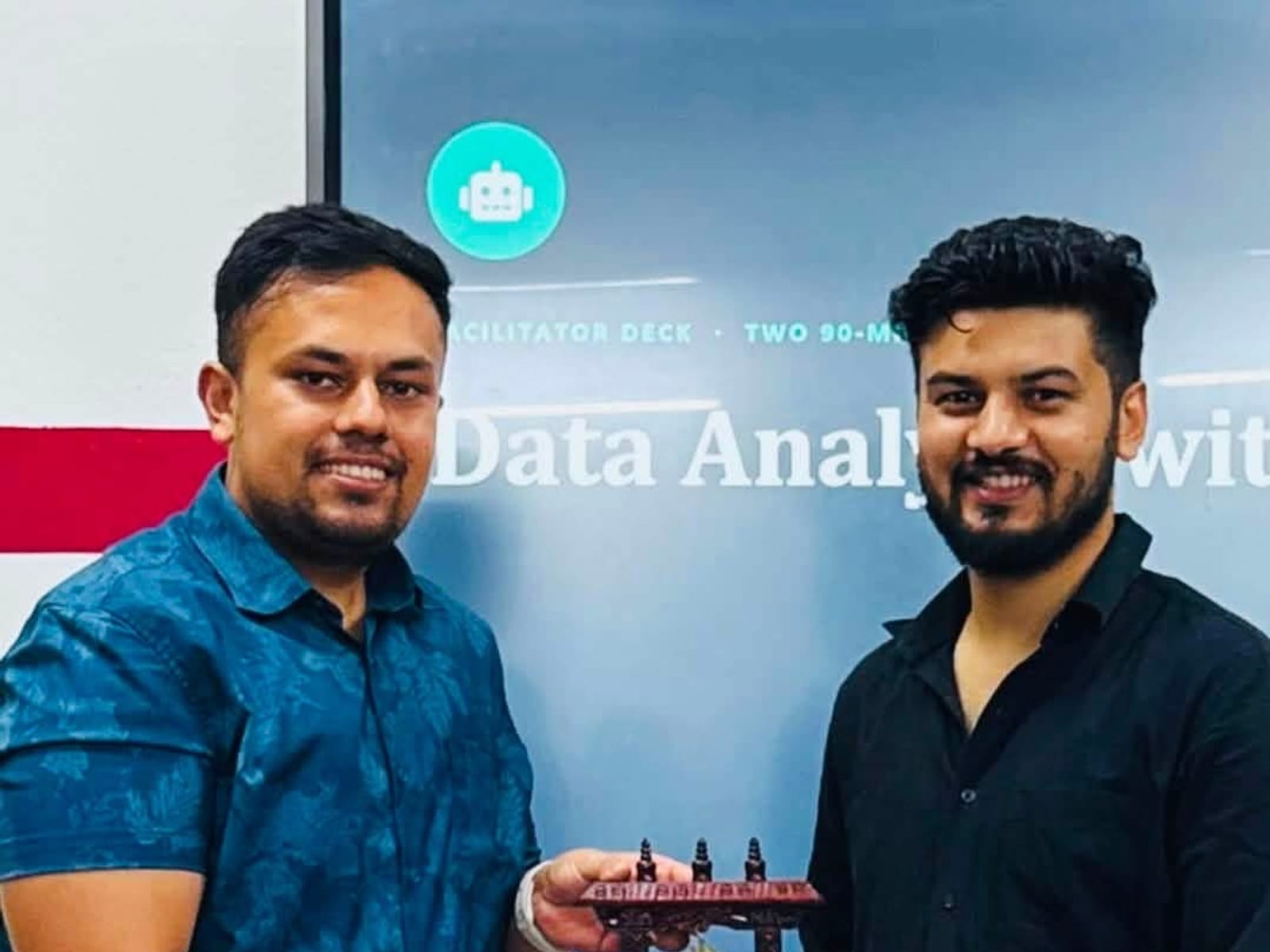Receiving a token of appreciation after the AI and Excel training